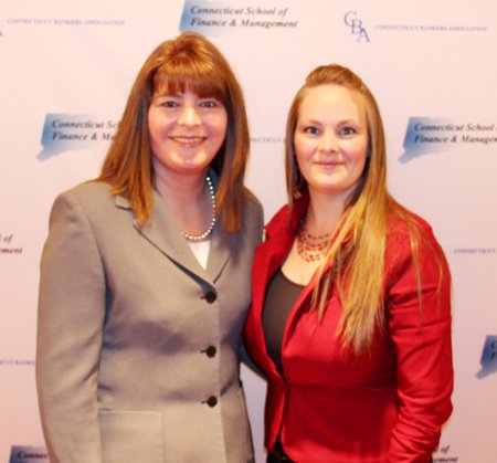 A portrait of Jennifer DeLucia and Kristen Scott in front of a white backdrop with blue Global Bankers Association logos