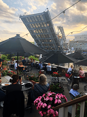 People eating on the deck of Tin Peddler in North Stonington 